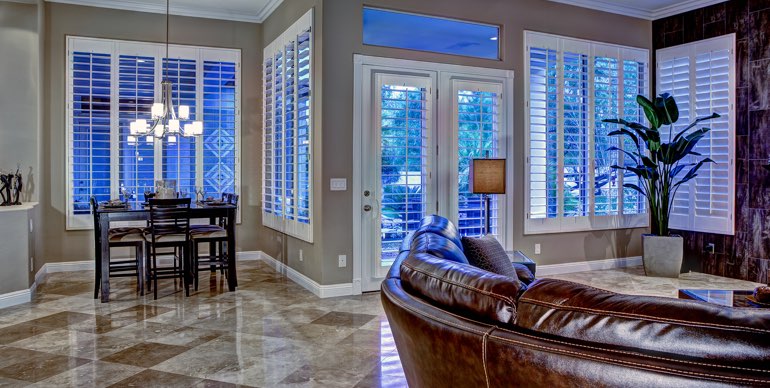 Gainesville great room with plantation shutters and tile floor.